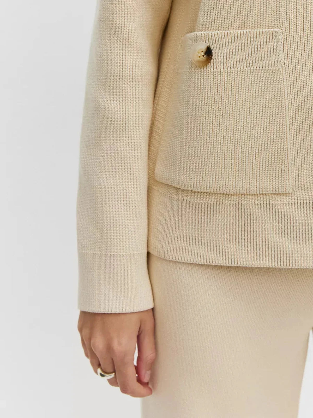 Sierra Cardigan by Lauven featuring cream button-up knit design and pocket detail for versatile fashion.