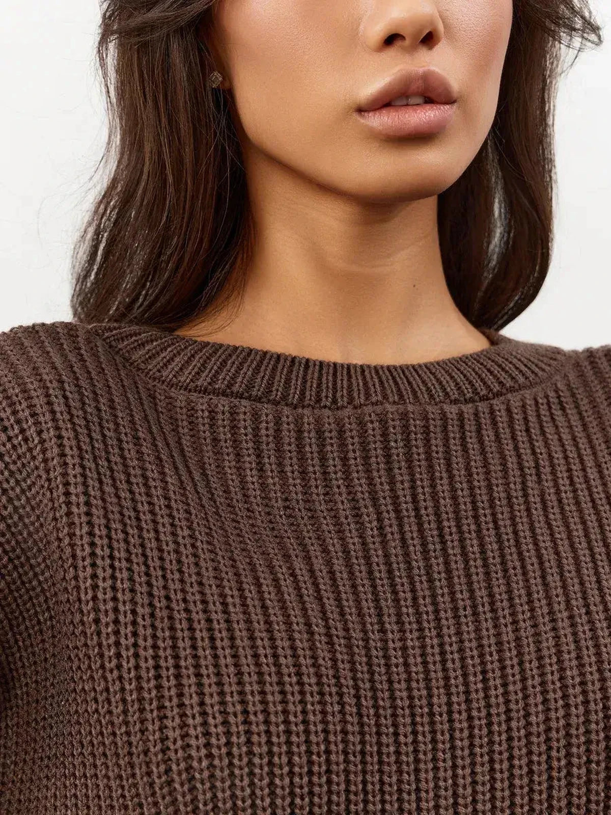 Close-up of Zara Sweater in oversized chocolate brown knit with crew neck, featuring Lauven branding.
