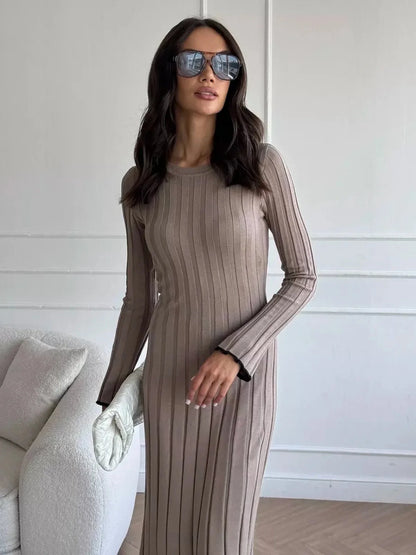 Stylish woman in a ribbed knit Contour Maxi Dress, showcasing full-length elegance and modern sunglasses.