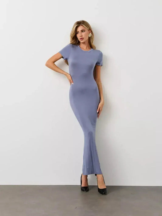 Model showcasing the Cloudline Maxi Dress in soft stretch jersey, featuring a T-shirt top and flared hem.