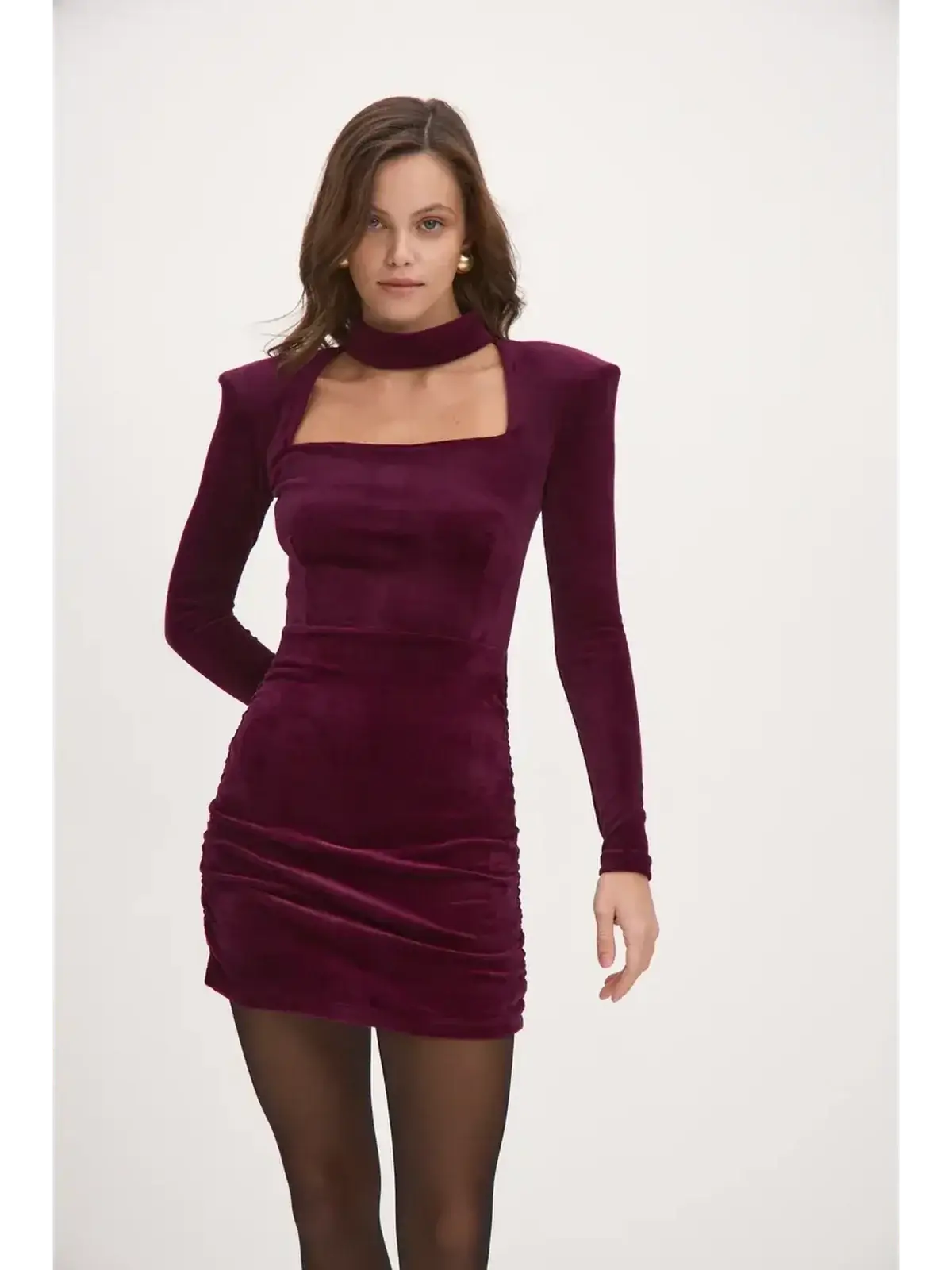 Burgundy Velvet Aura mini dress with long sleeves, choker neckline, and bodycon silhouette, perfect for parties.