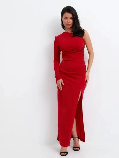 Model in red glitter one-shoulder maxi dress with thigh-high slit, showcasing elegant evening wear style.