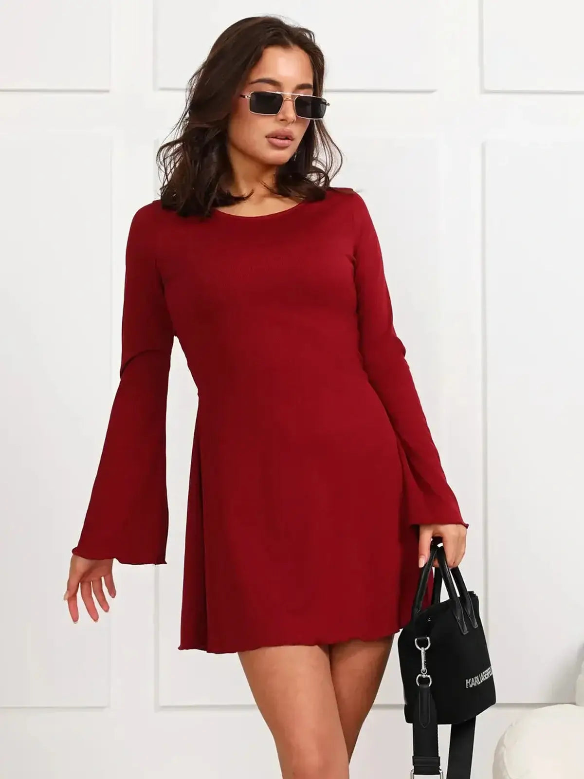 Ruby Laced red mini dress with long bell sleeves, perfect for parties and special occasions.