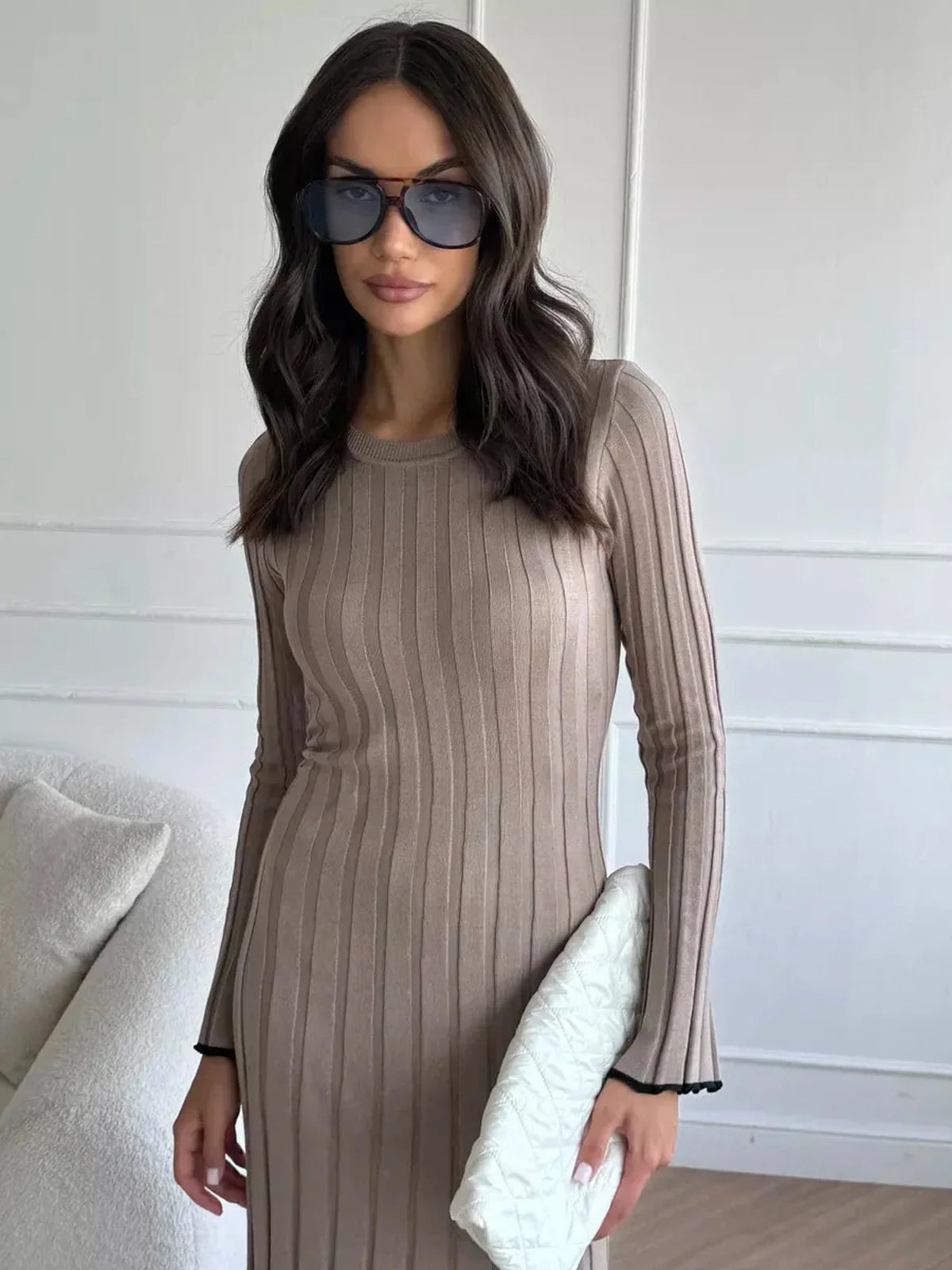 Model wearing Contour Maxi Dress, showcasing the ribbed knit design and stylish accessories.