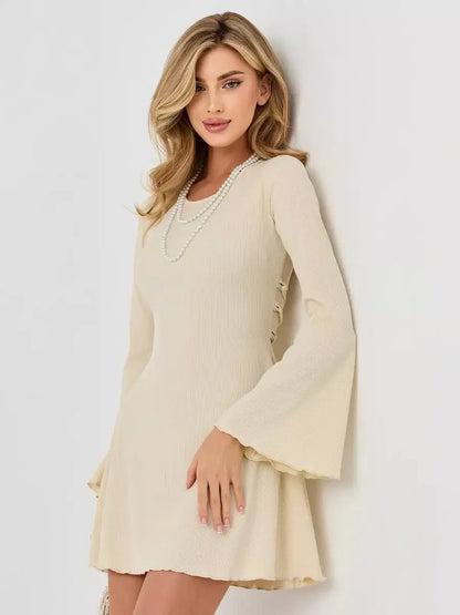 Ivory Flare long sleeve mini dress with flared bell sleeves and ribbed texture, perfect for summer weddings and cocktail parties.