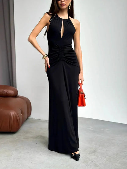 Elegant black maxi dress with halter neckline, keyhole cutout, and draped detailing, perfect for evening occasions.