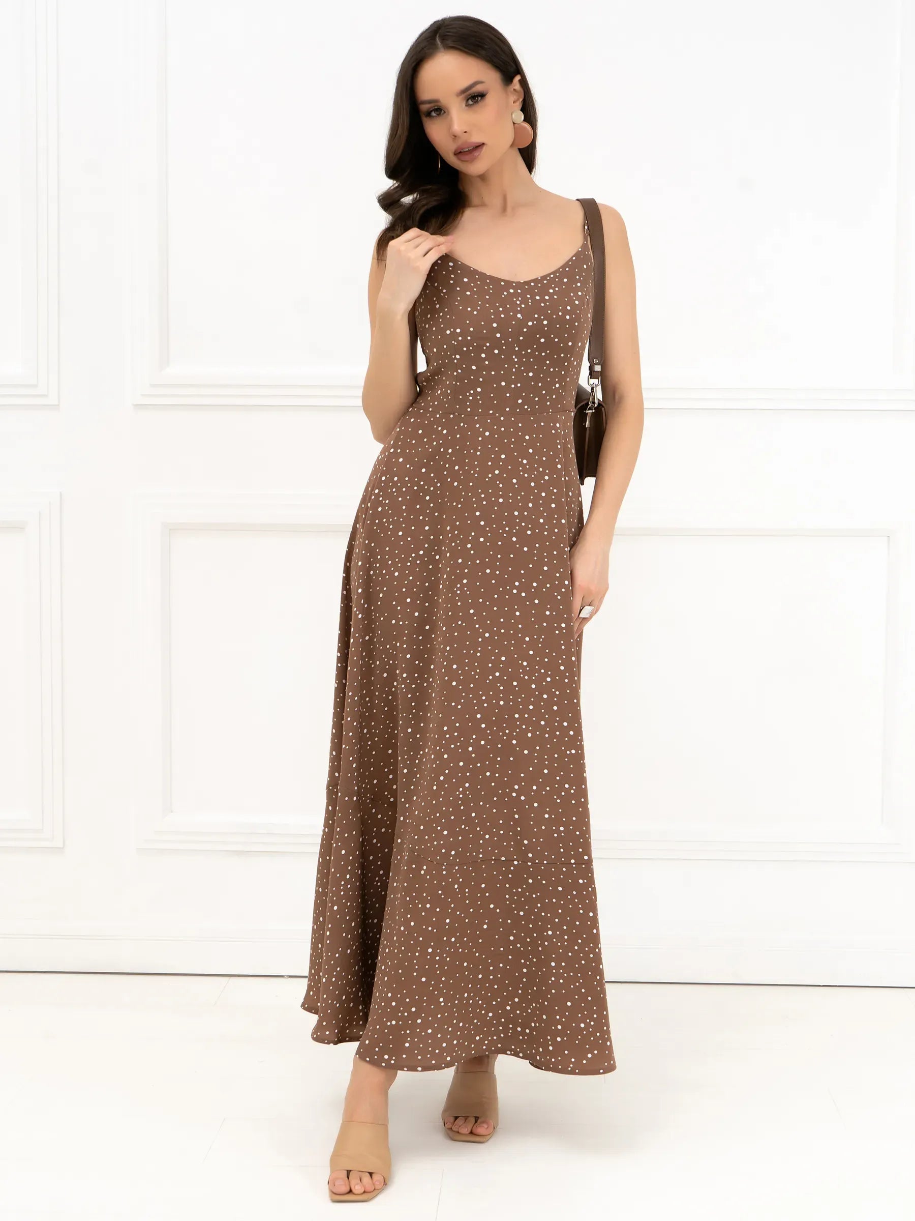Polka Bow Maxi Dress in brown with polka dots, featuring a sleeveless silhouette and A-line cut, perfect for warm weather.
