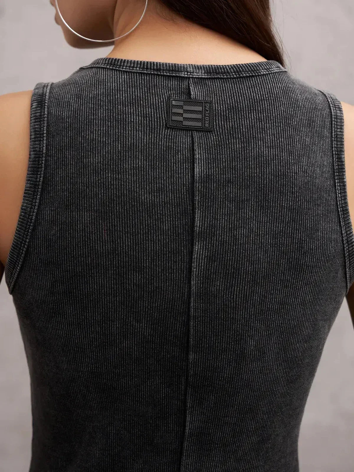 Back view of Shadow Curve Maxi Dress in graphite, showcasing sleeveless design and textured ribbed fabric.