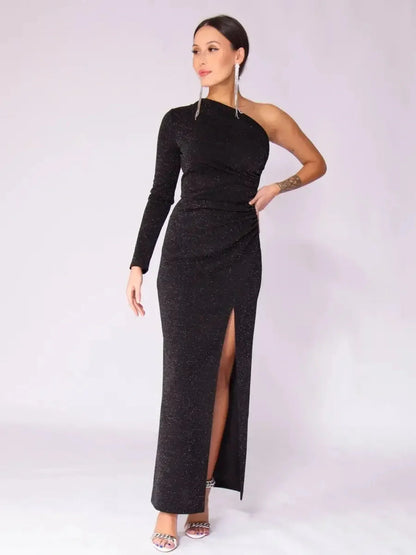 Model wearing Luna Noir Maxi Dress featuring a one-shoulder design, drape, leg slit, and elegant sparkle for evening wear.