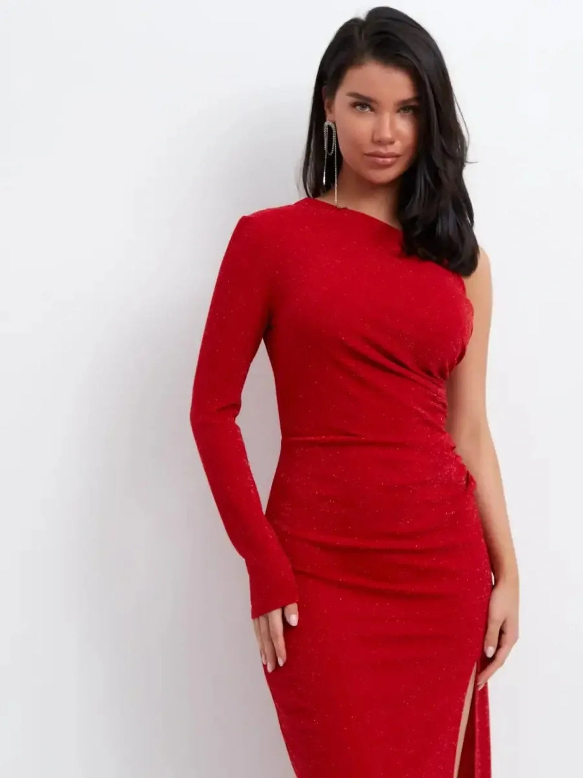 Red glitter one-shoulder maxi dress with thigh-high slit, perfect for elegant evening events.