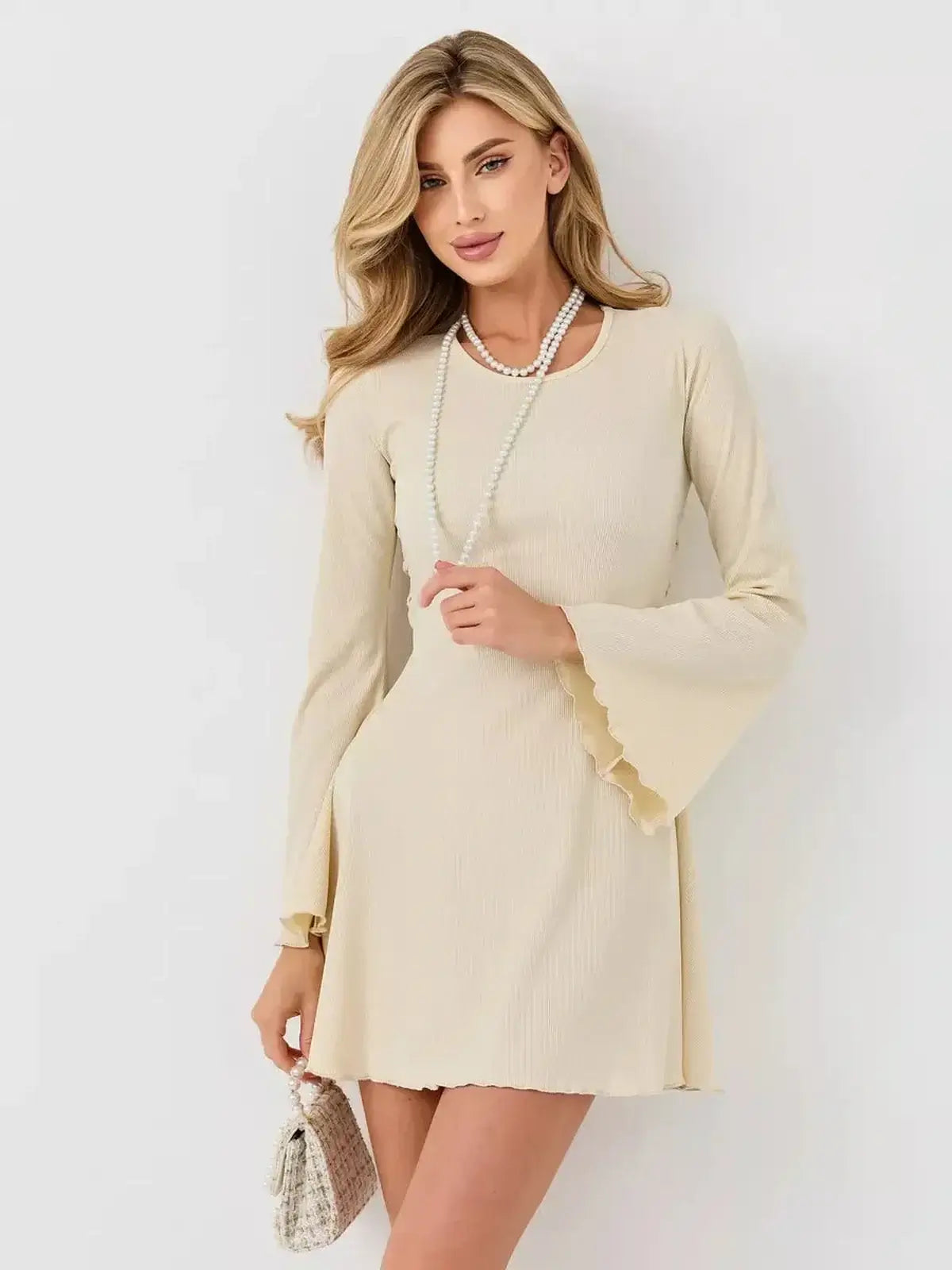 Ivory Flare long sleeve mini dress with flared bell sleeves, perfect for weddings, parties, and summer events.