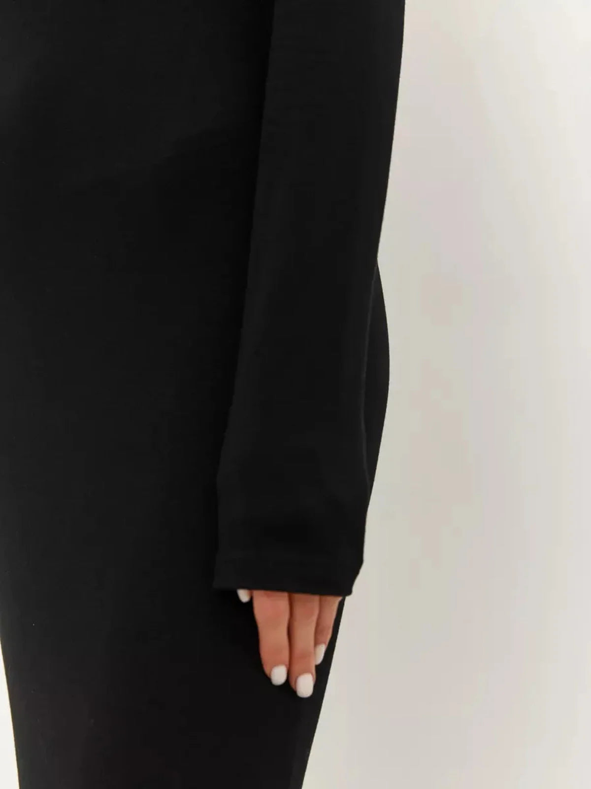 Close-up of the long sleeve of the Noir Maxi Dress showcasing its minimalist design and seamless fit.