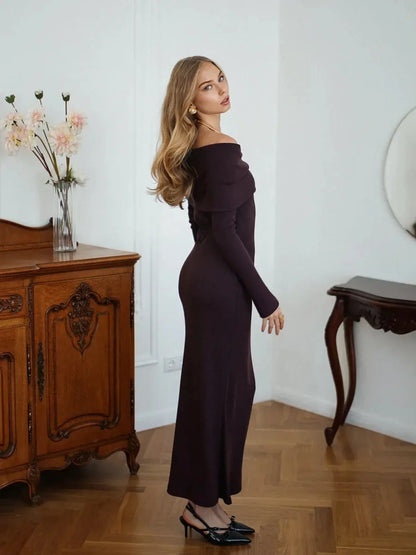 Elegance Maxi Dress in off-shoulder silhouette, ribbed texture, perfect for sophisticated occasions. Model posing elegantly.