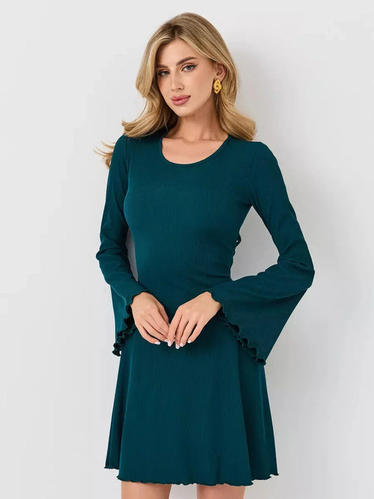 Emerald Whisper mini dress featuring a flared A-line silhouette and bell sleeves in a rich emerald green color.
