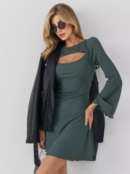 Model wearing a dark olive mini dress with bell sleeves and cut-out neckline, paired with a leather jacket and sunglasses.