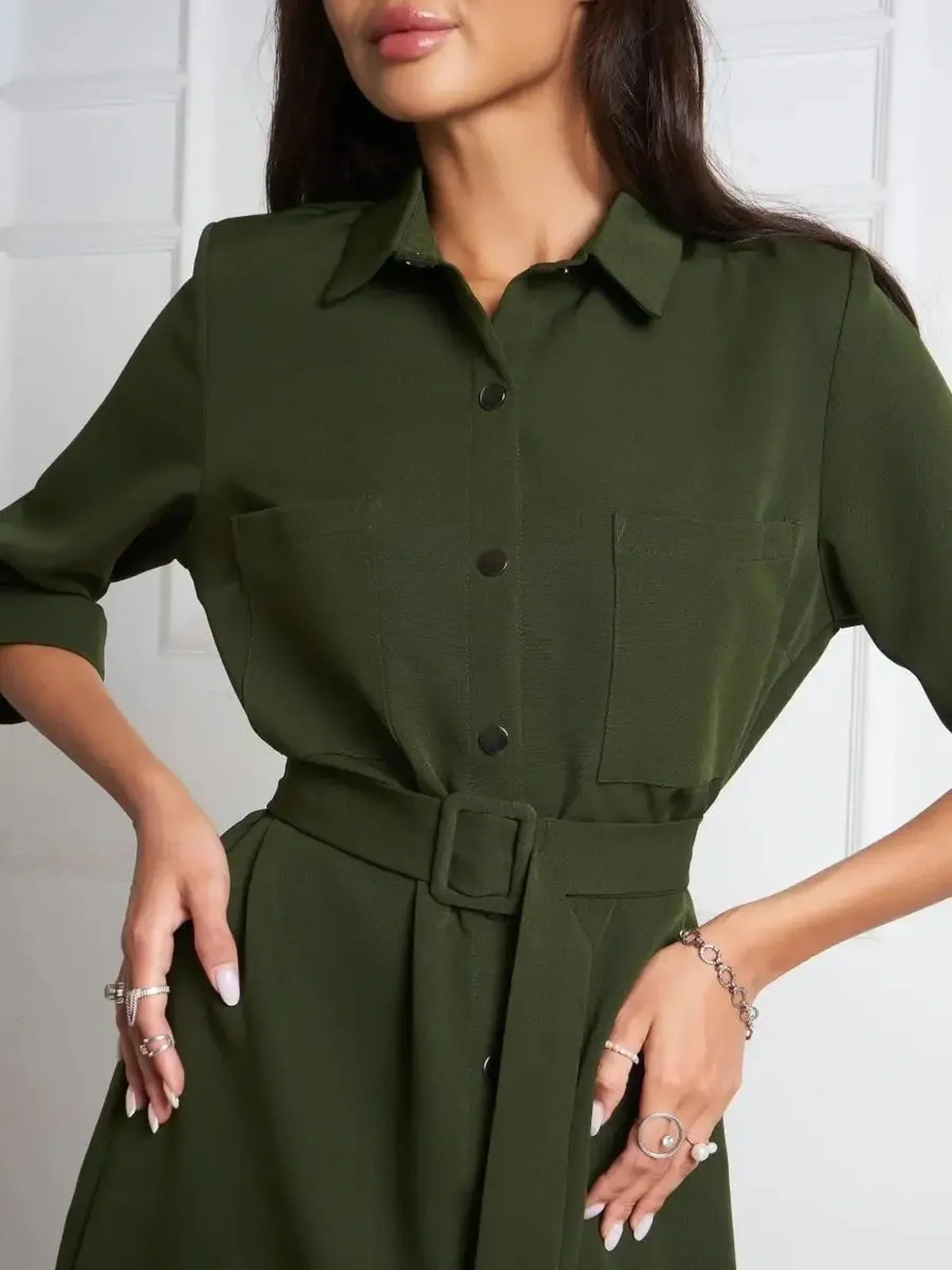 Detail view of Urban Utility belted shirt mini dress in olive green, showcasing the structured design and polished buttons.