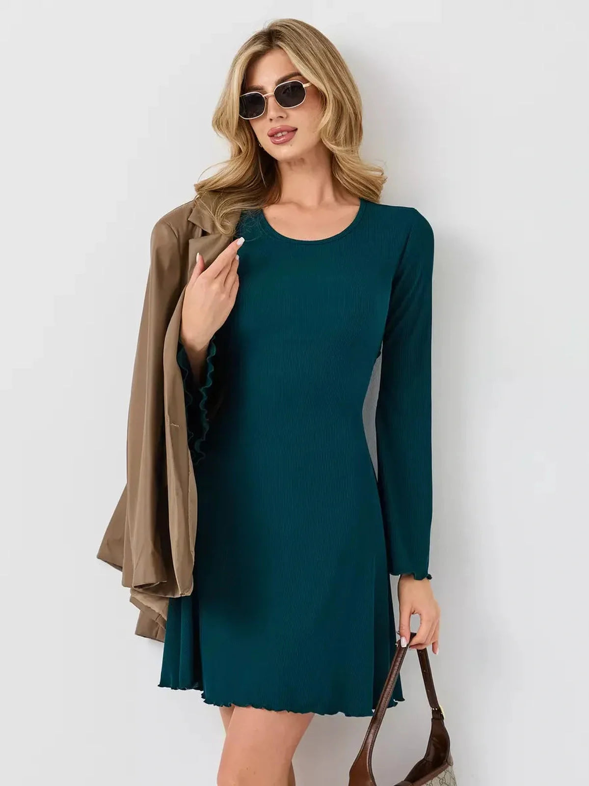 Emerald Whisper mini dress featuring a flattering A-line silhouette, perfect for day-to-night style.