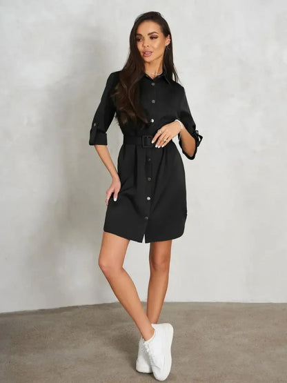 Urban Edit Mini black dress with structured shirt silhouette and detachable belt, exuding understated elegance.