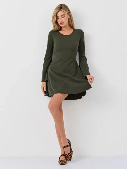Model wearing the Ivy Bell mini dress, featuring flared bell sleeves and a U-shaped neckline in olive green.