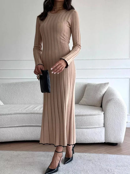 Model wearing the Sahara Curve Maxi Dress in Sandstone Beige with ribbed texture, exuding elegance and comfort.
