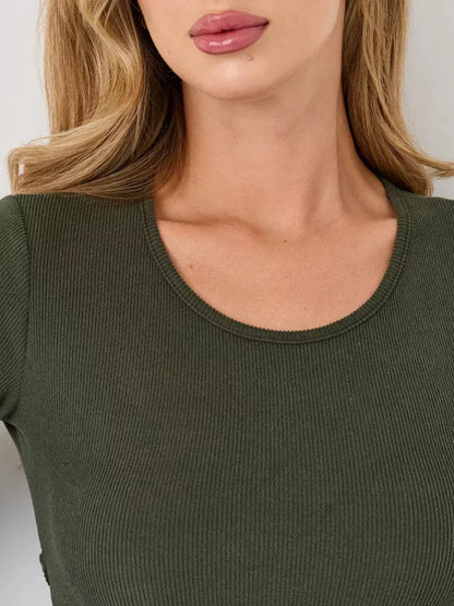 Close-up of a U-shaped neckline on a ribbed olive green mini dress featuring soft, structured fabric.