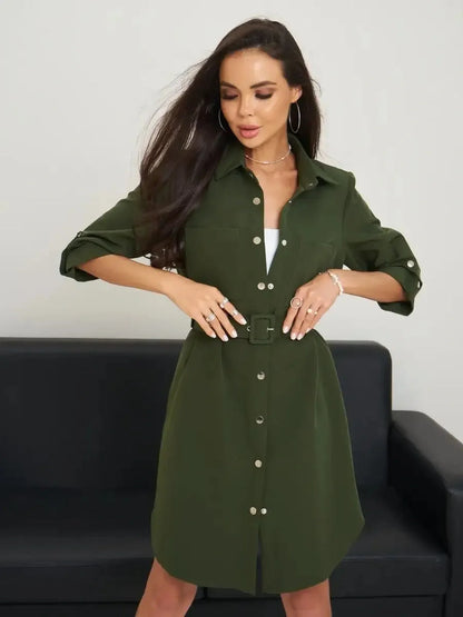 Model wearing an olive green belted shirt mini dress with snap-button front, perfect for urban outings.