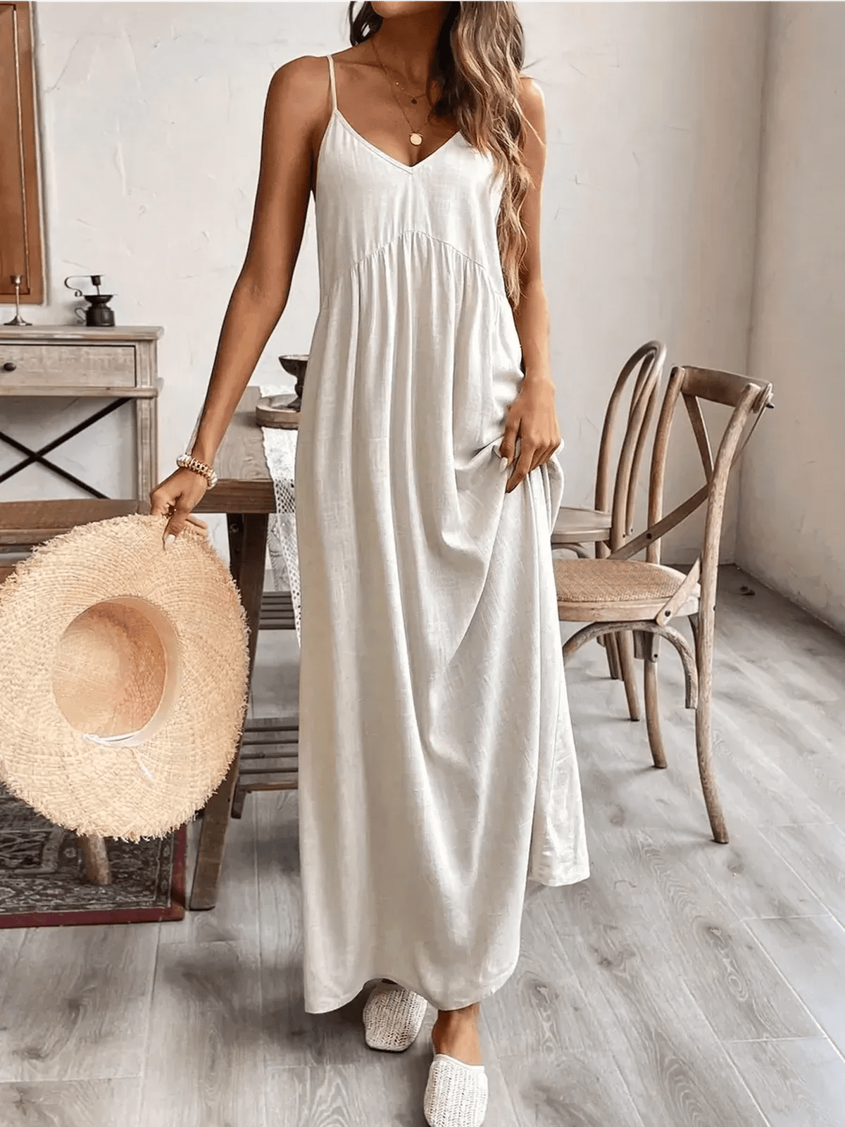 Serenity Maxi Dress in lightweight fabric, styled with a wide-brimmed hat and relaxed footwear, perfect for summer outings.