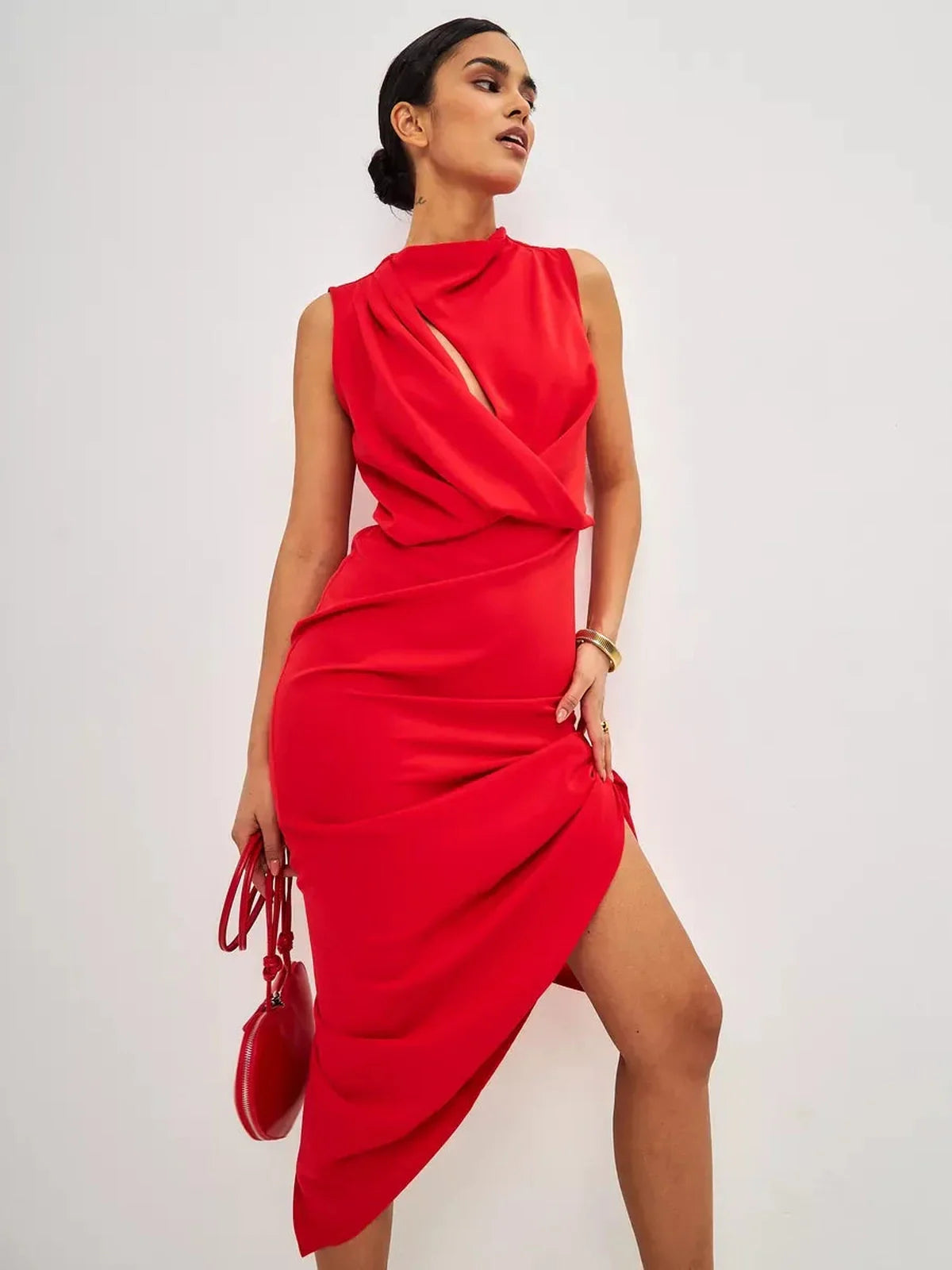 Model showcasing a stylish Red Drape Maxi Dress with a fluid silhouette and elegant neckline.