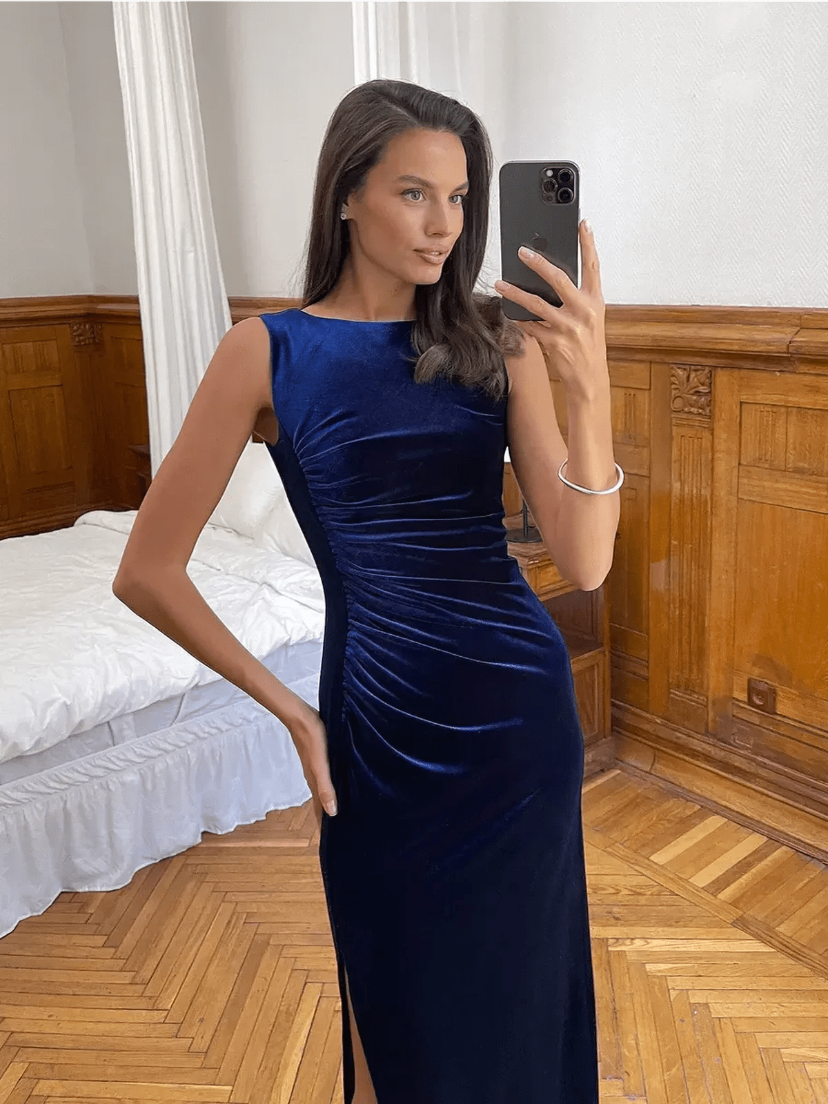 Model wearing the Velvet Grace Maxi Dress in midnight blue, showcasing a sculpted silhouette and elegant design.