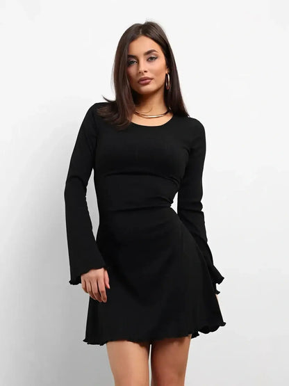 Elegant black mini dress with long flared sleeves, perfect for parties or weddings.