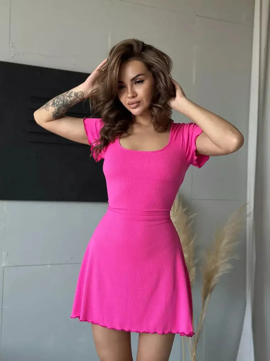 Model wearing a vibrant pink midi dress with flutter sleeves, perfect for summer parties and special occasions.