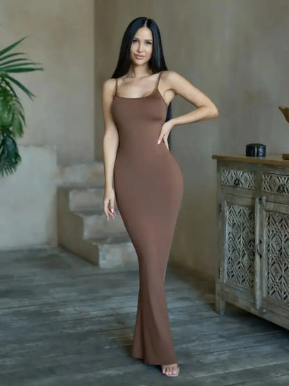 Model wearing Cocoa Curve Maxi Dress in deep brown, showcasing sleek silhouette and minimalistic style.