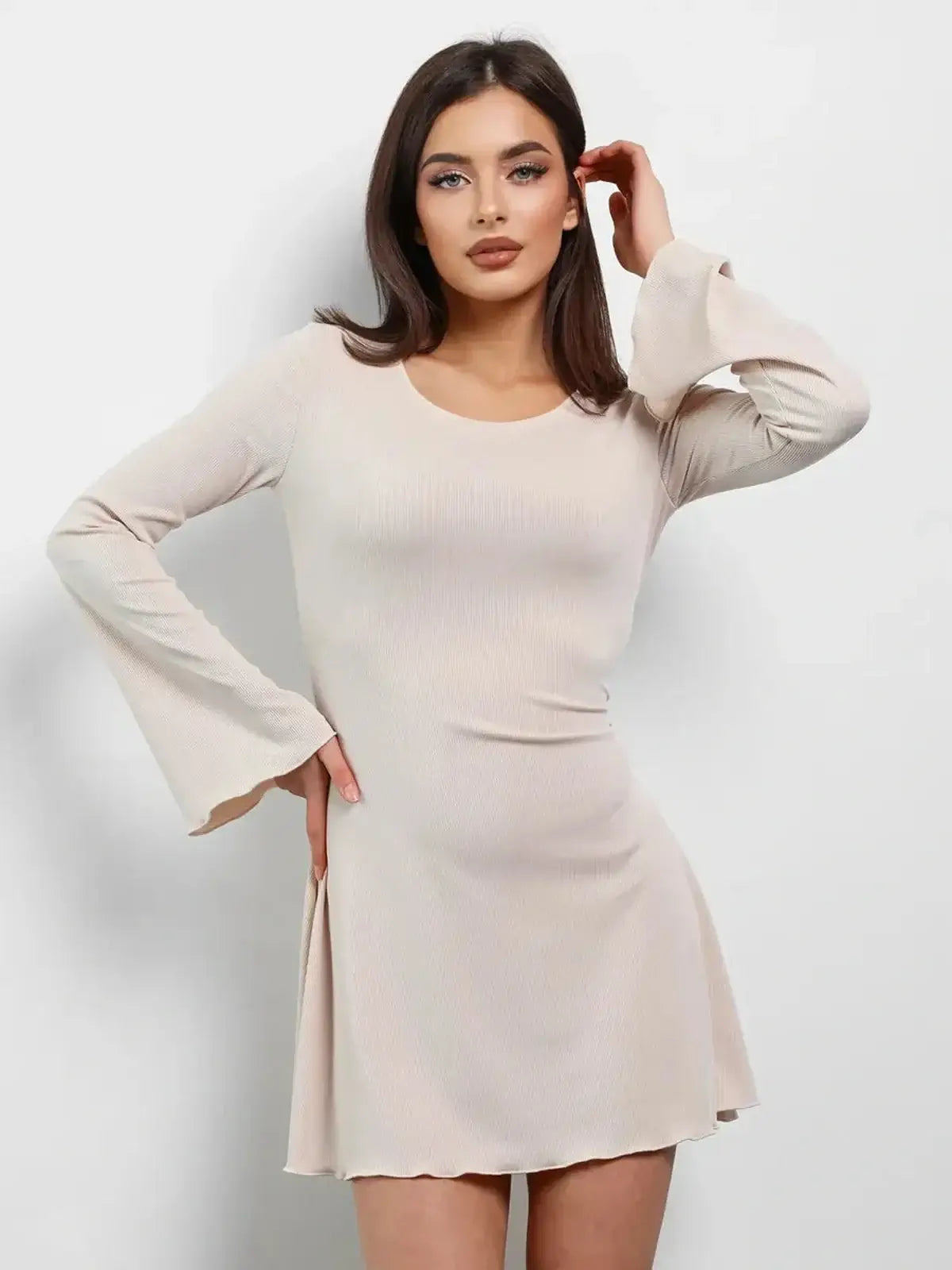 Cream Laced long sleeve mini dress in ribbed fabric, perfect for summer and wedding guest occasions.