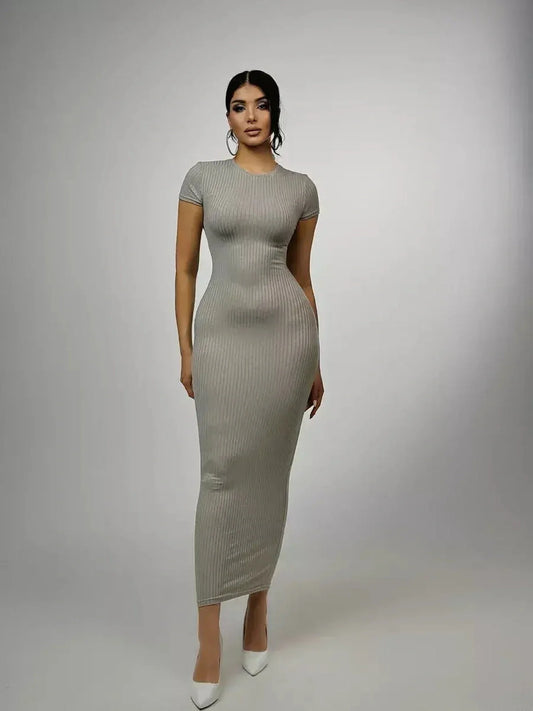 Sculpted Grace Maxi Dress in soft ribbed knit, featuring a figure-hugging silhouette and modern elegance for casual wear.