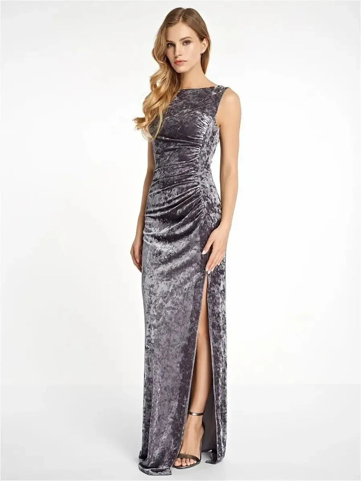 Elegant woman in Luxe Velvet Maxi Dress featuring ruched side and leg slit in crushed velvet texture.