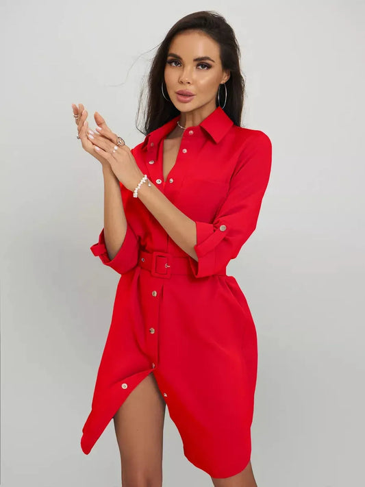 Model showcasing the Scarlet Belted Mini dress, featuring a sculpted fit and a chic shirt-dress style in vibrant red.