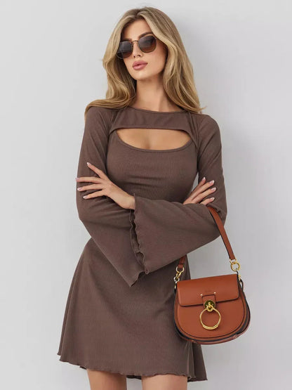 Model showcasing the Café Flare mini dress with a chest cut-out in coffee hue, paired with stylish sunglasses and handbag.