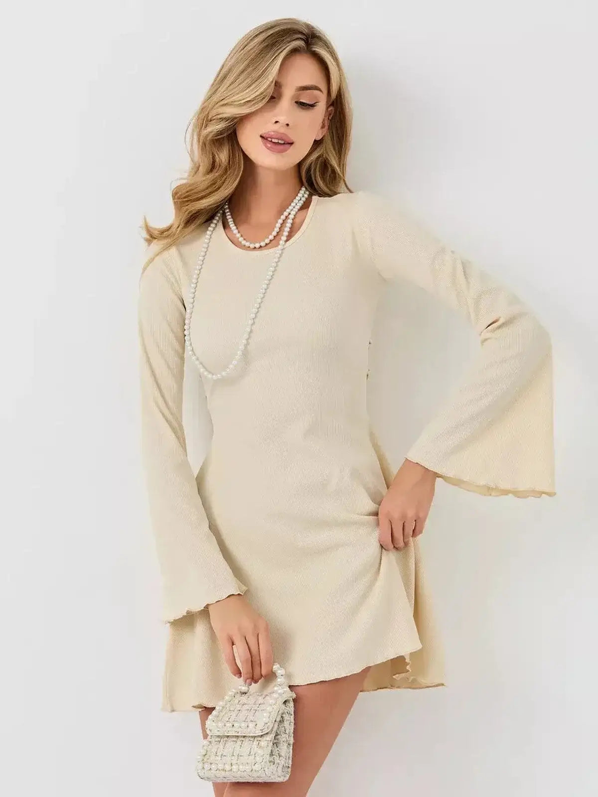 Ivory Flare long sleeve mini dress with flared sleeves, perfect for weddings, parties, and summer occasions.