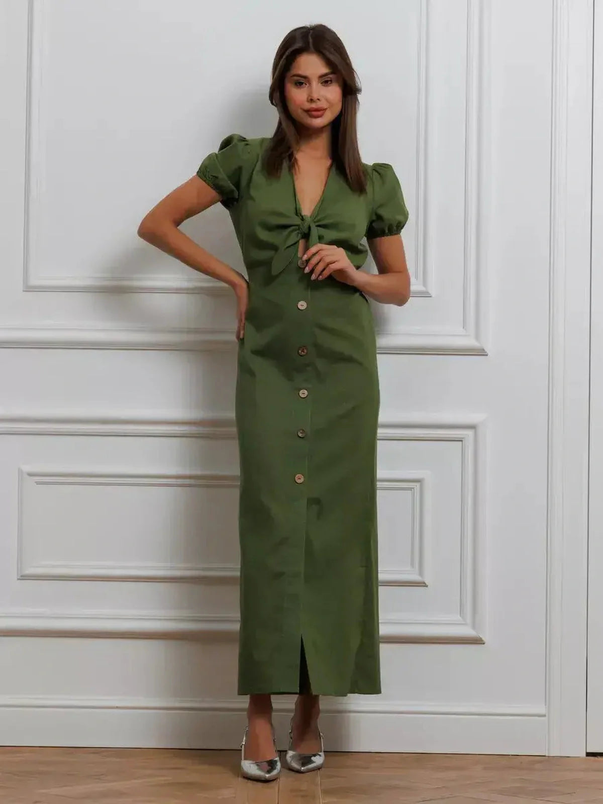 Olive Whisper Maxi Dress featuring puff sleeves, tie front, and button details in an elegant khaki color.