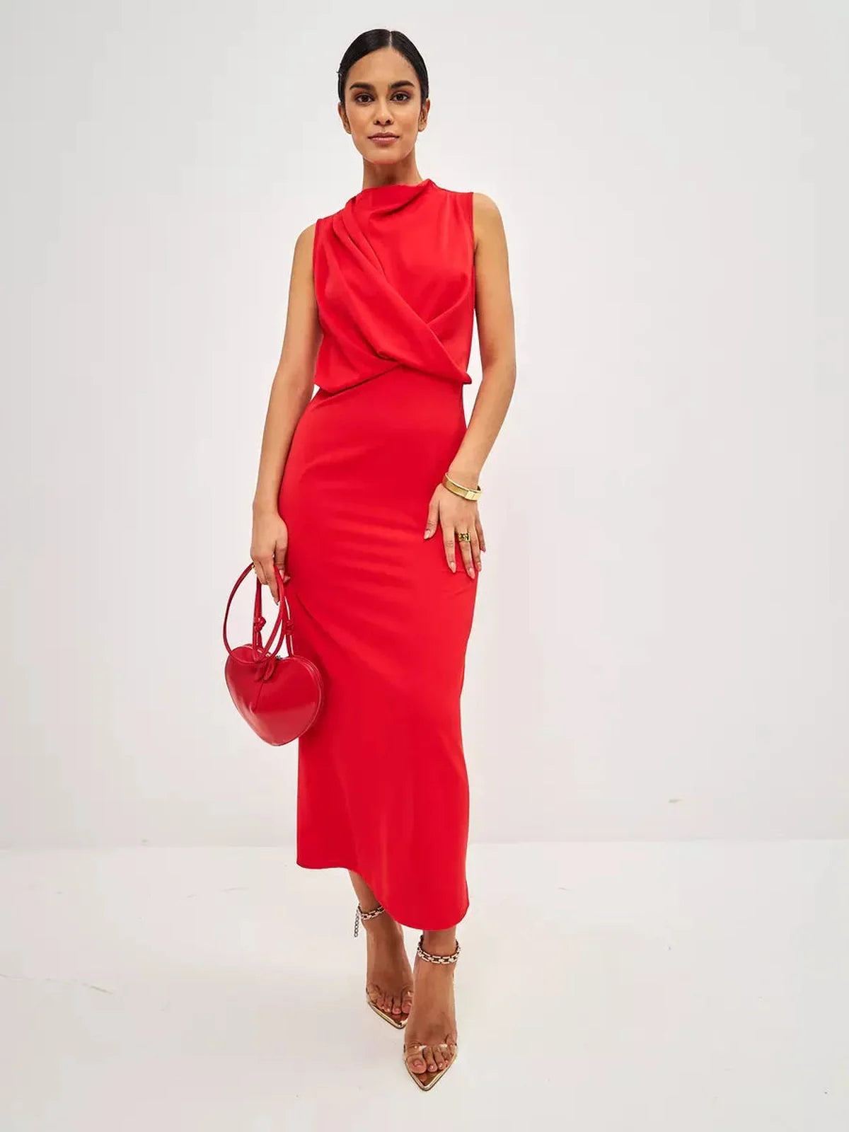 Elegant woman in a red drape maxi dress, featuring a stylish neckline and sleek silhouette, perfect for formal events.