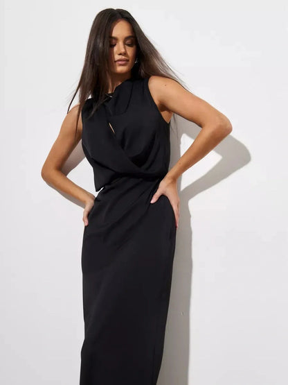Elegant model showcasing the Noir Drape Maxi Dress in a sleek black design, ideal for formal occasions.