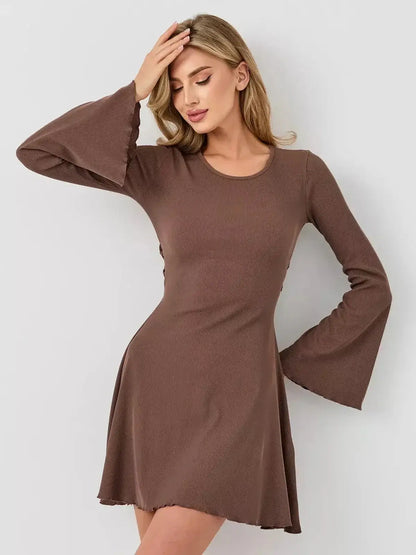 Model wearing the Mocha Flare mini dress with long bell sleeves in a rich coffee tone, perfect for summer and formal occasions.