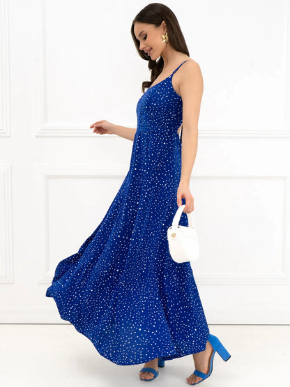 Celeste Maxi Dress in electric blue with back bow detail, ideal for warm weather and special occasions.