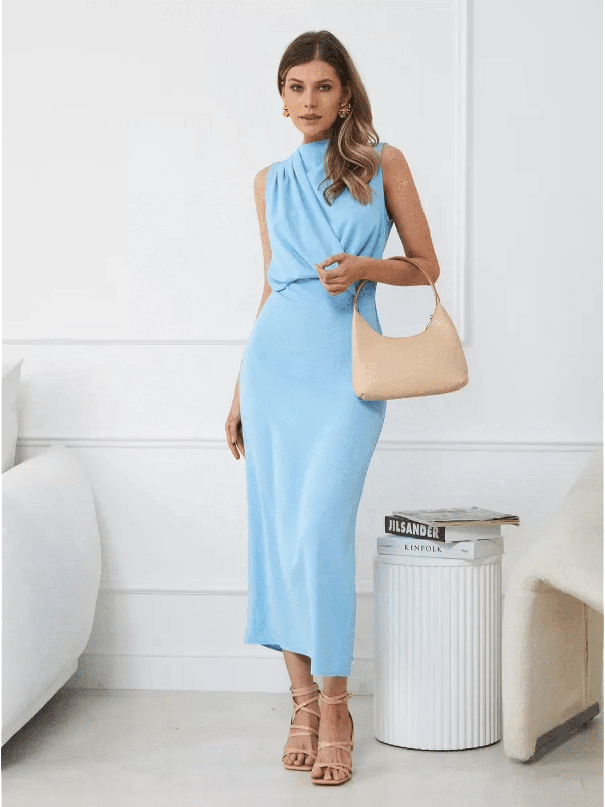 Model wearing the Sculpted Grace Maxi Dress in light blue, showcasing a sleek draped silhouette and elegant styling.