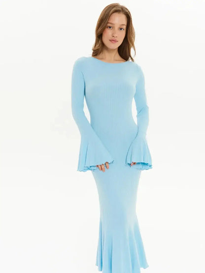 Light blue long sleeve midi dress with bell sleeves and flared hem, embodying effortless glamour.