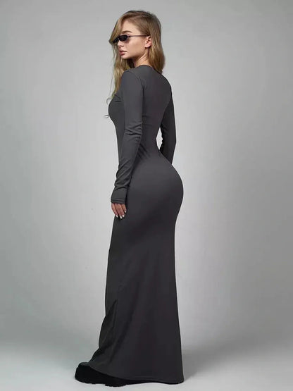 Sculpted Grace Maxi Dress in sleek ribbed knit, showcasing elegant long sleeve silhouette and flattering fit.