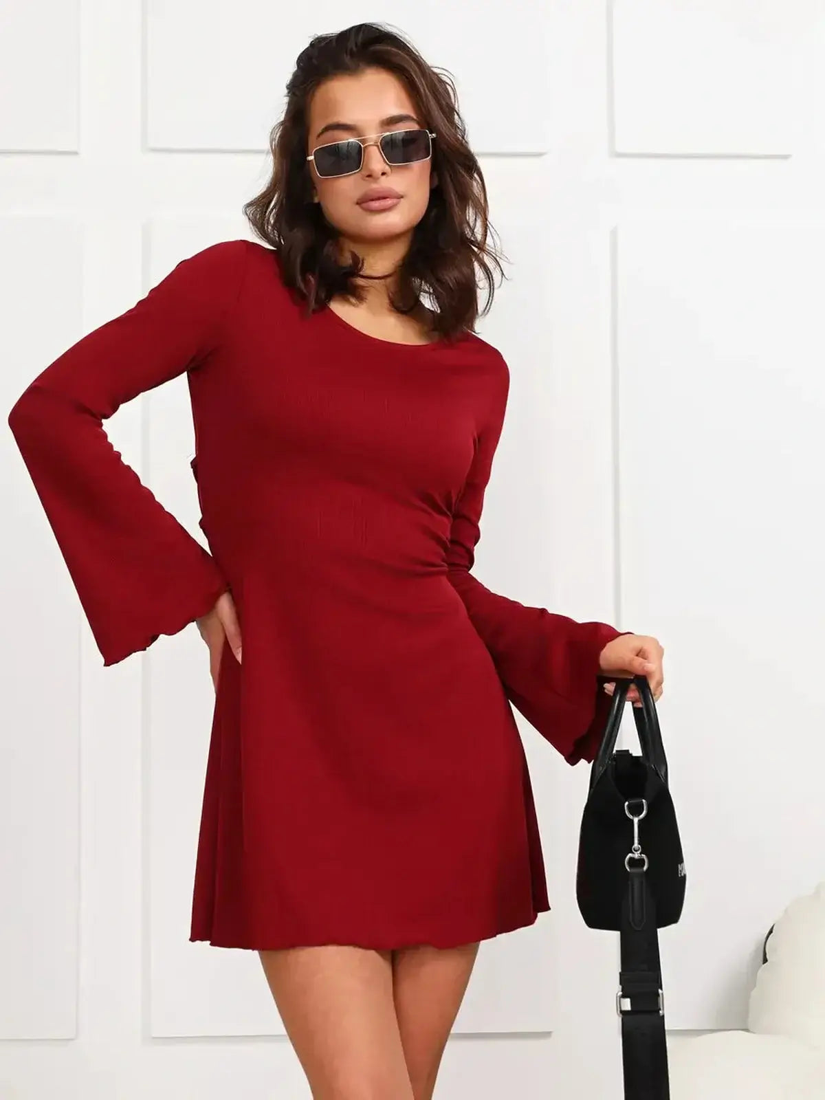 Ruby Laced red mini dress with long bell sleeves, perfect for parties or graduation.