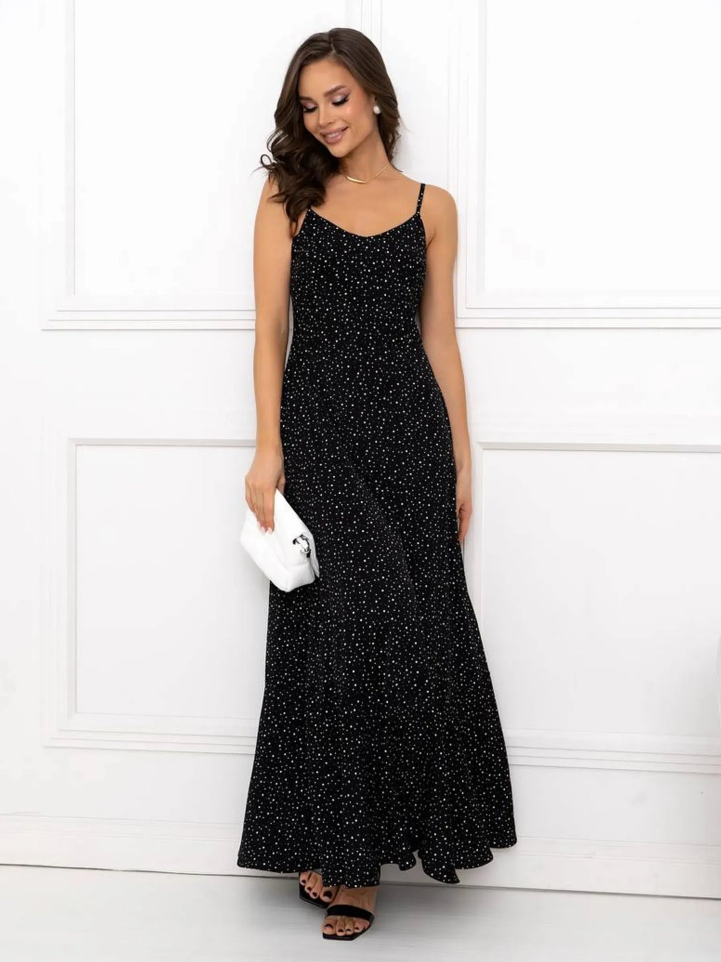 Starlight Maxi Dress featuring a black polka-dot pattern, A-line silhouette, and open-back detail, perfect for summer elegance.