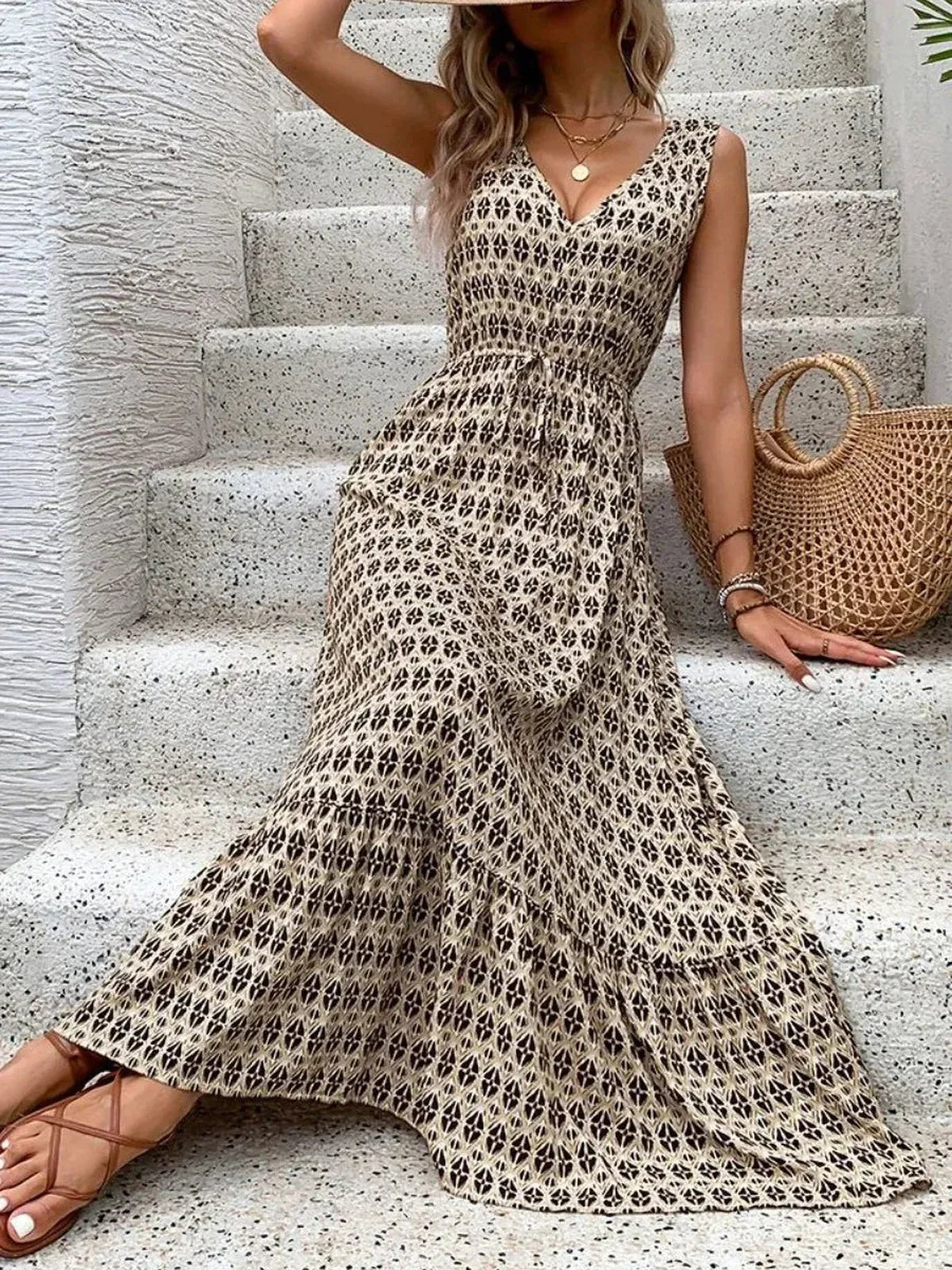 Solana Maxi Dress featuring a V-neckline and tiered skirt, perfect for summer outings with a boho-inspired print.