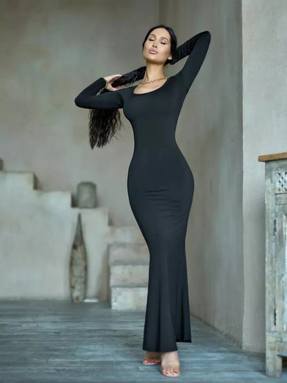 Sculpted Noir Maxi Dress featuring long sleeves and a sleek silhouette, perfect for elegant evening occasions.